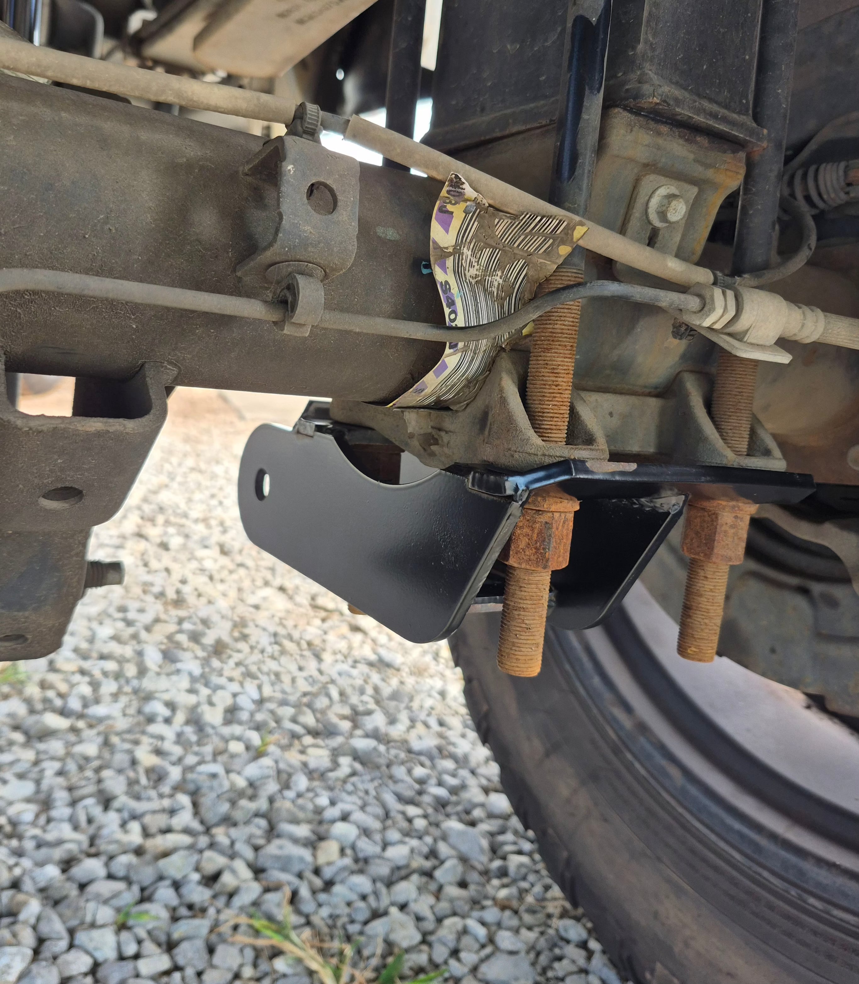 1994-2002 Dodge Ram 1500 boxed ladder traction bars in raw steel for axle wrap control and show-style appearance