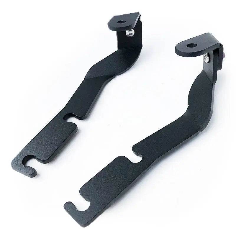 2016-2020 Toyota Tacoma with black hood ditch light mounts installed on hood hinges