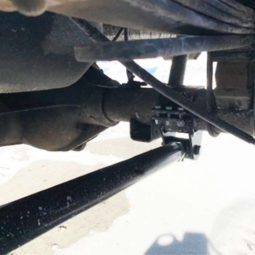 2005-2010 Ford Super Duty F-250 with boxed ladder traction bars installed for axle wrap control and lifted truck compatibility