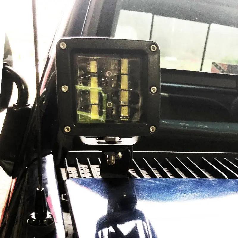 1989-1999 GMC Yukon Hood Ditch Light Mounts black steel bracket installation on SUV hood